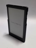 Xteink X4 Pro 3D printed case in black, front view. Small text on the screen reads Prints @ Simber.
