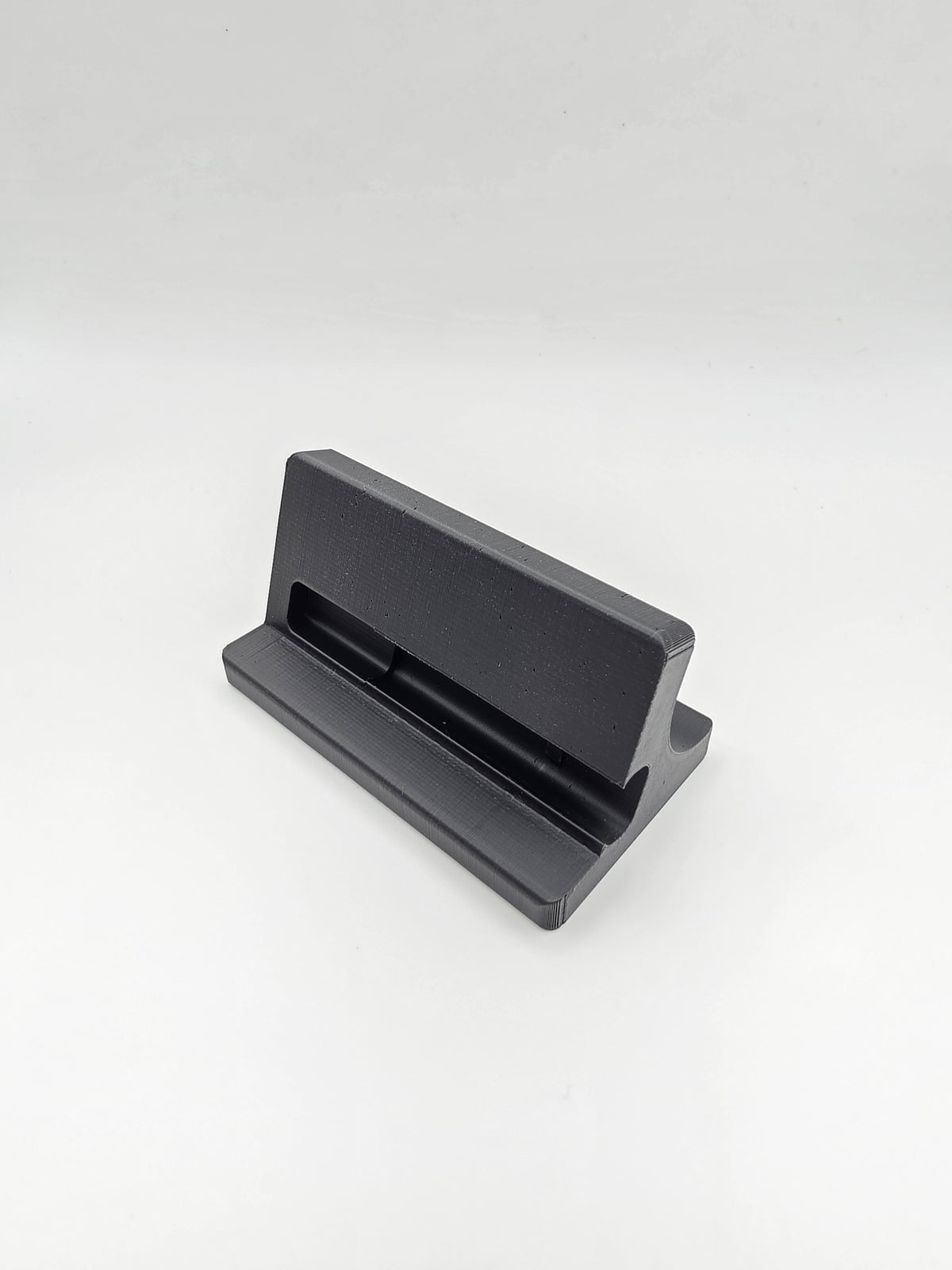 A black and gray 3D-printed stand, side view